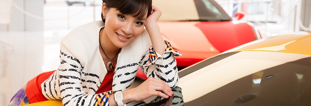 Asian female in fashion shoot with Escada x Cartier x Ferrari