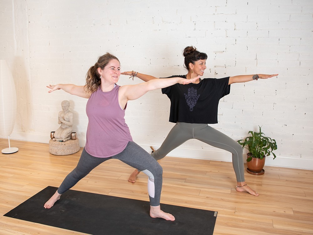 Two women in yoga pose in Sydney studio